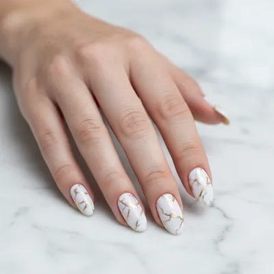 White-marble-with-gold-veining Long Oval Nails
