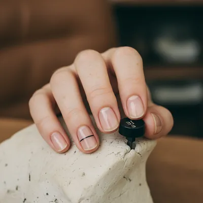 Minimal-aesthetic Short Round Nails in Sheer Nude With a Single Fine c