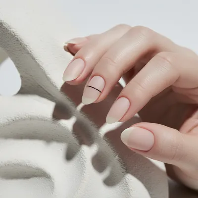 Minimal-aesthetic Short Almond Nails in Bare Buff With a Single Fine b